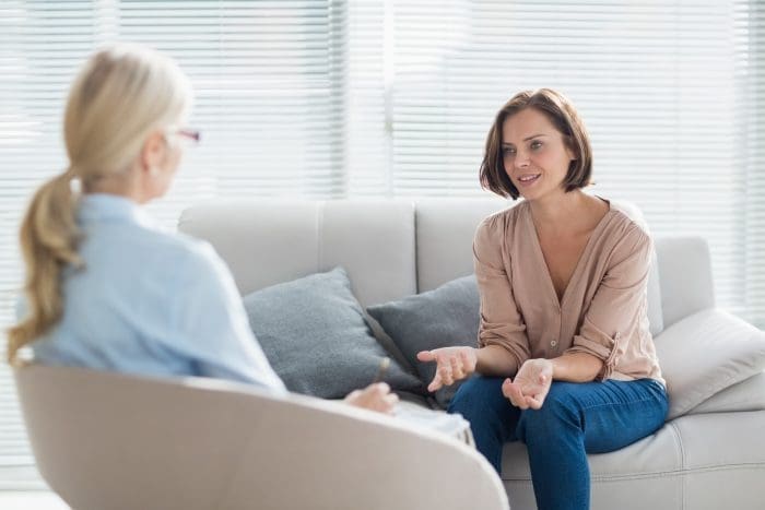 Woman talking to therapist Woman talking to therapist